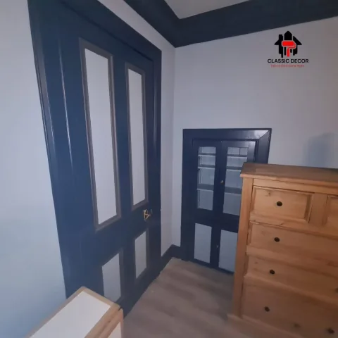 Interior with contrasting dark blue woodwork