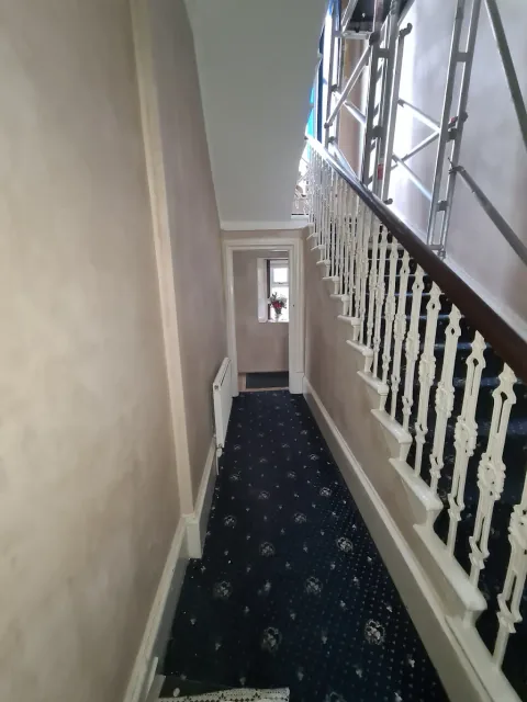 Traditional staircase with white balustrades