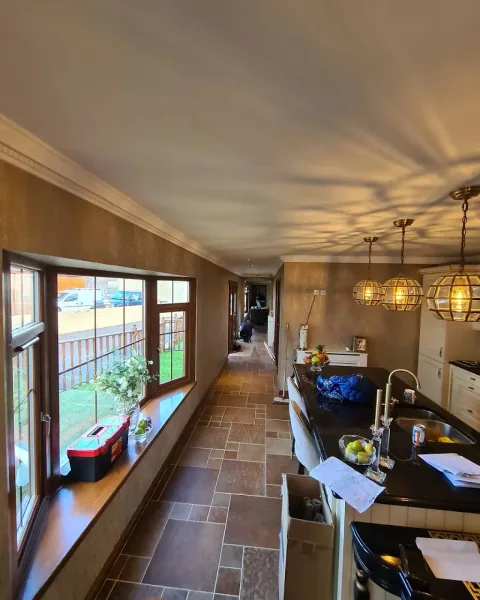 Dining room with gold lighting and decorated walls